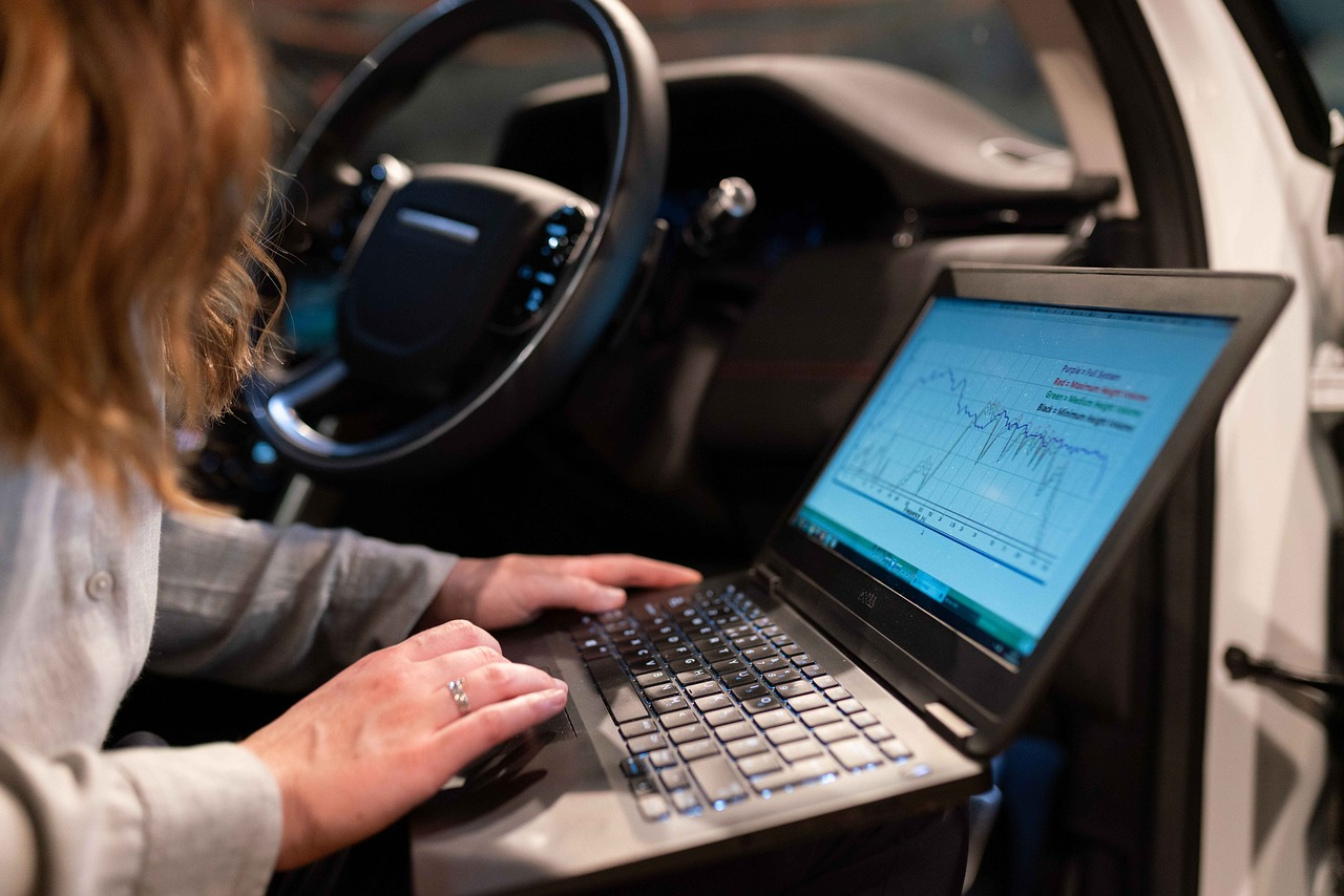 Technician running diagnostics on a car